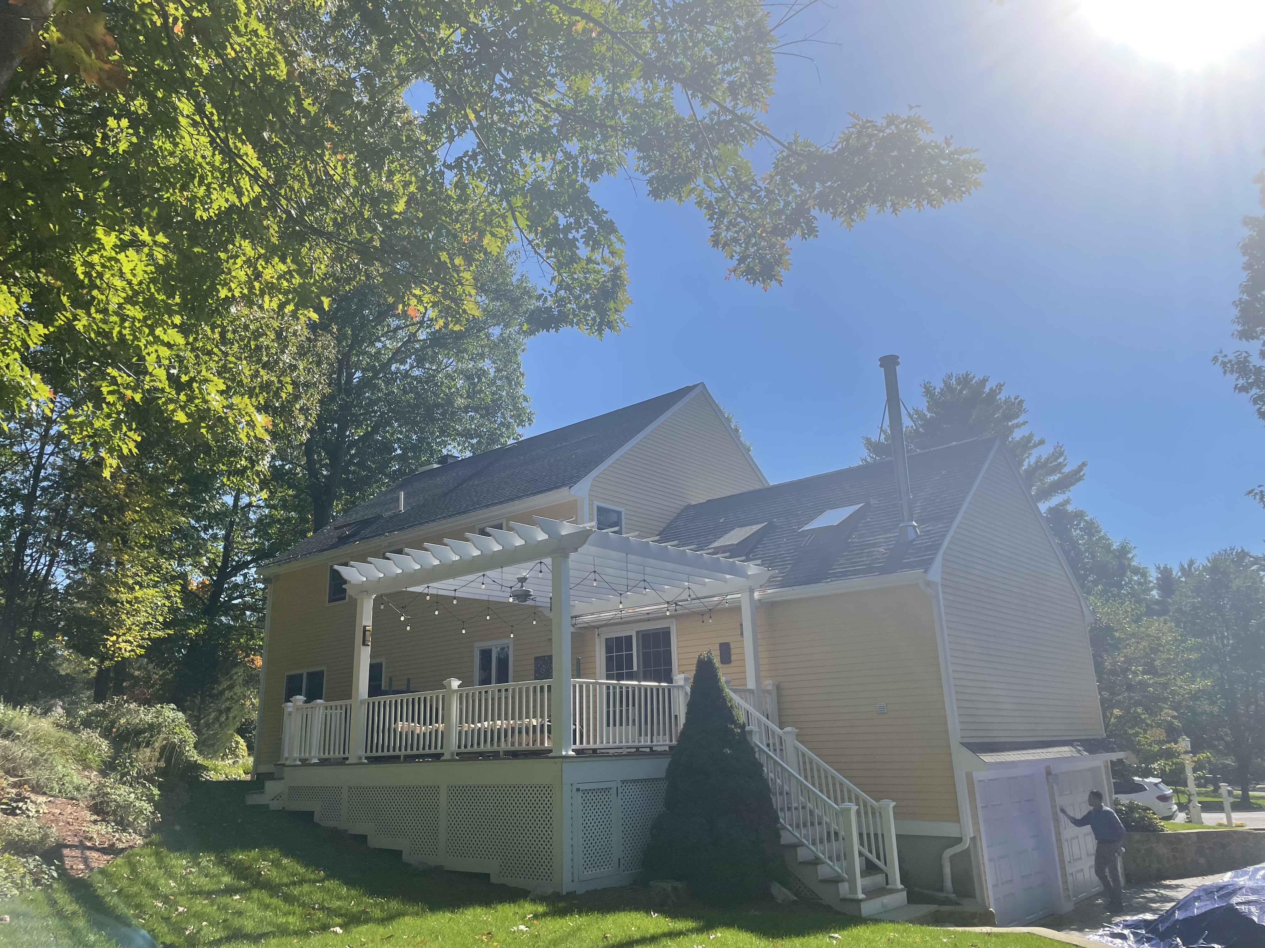 Colonial home exterior in Beverly, MA with a completed architectural shingle roof by Storm King Roofing
