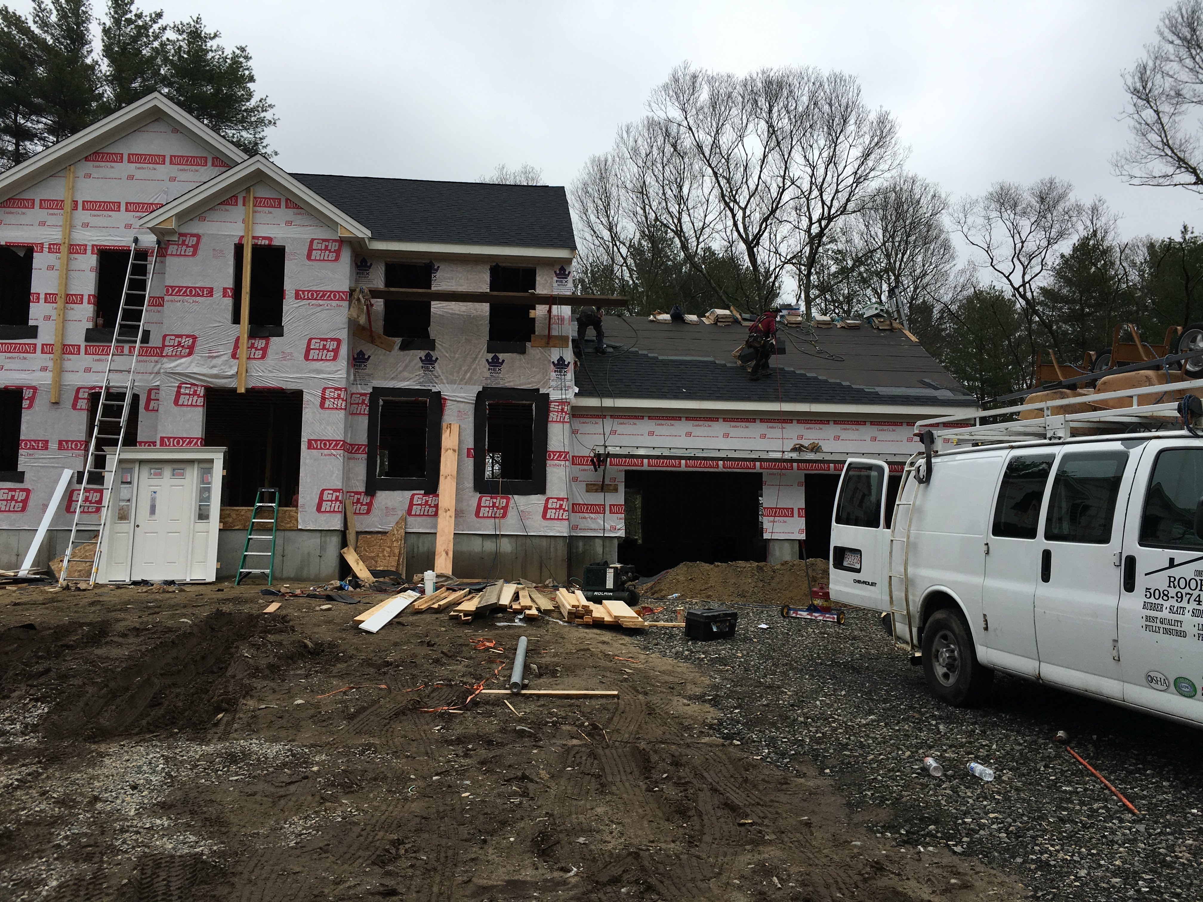 Storm King Roofing crew working on a new colonial home in Milton, MA
