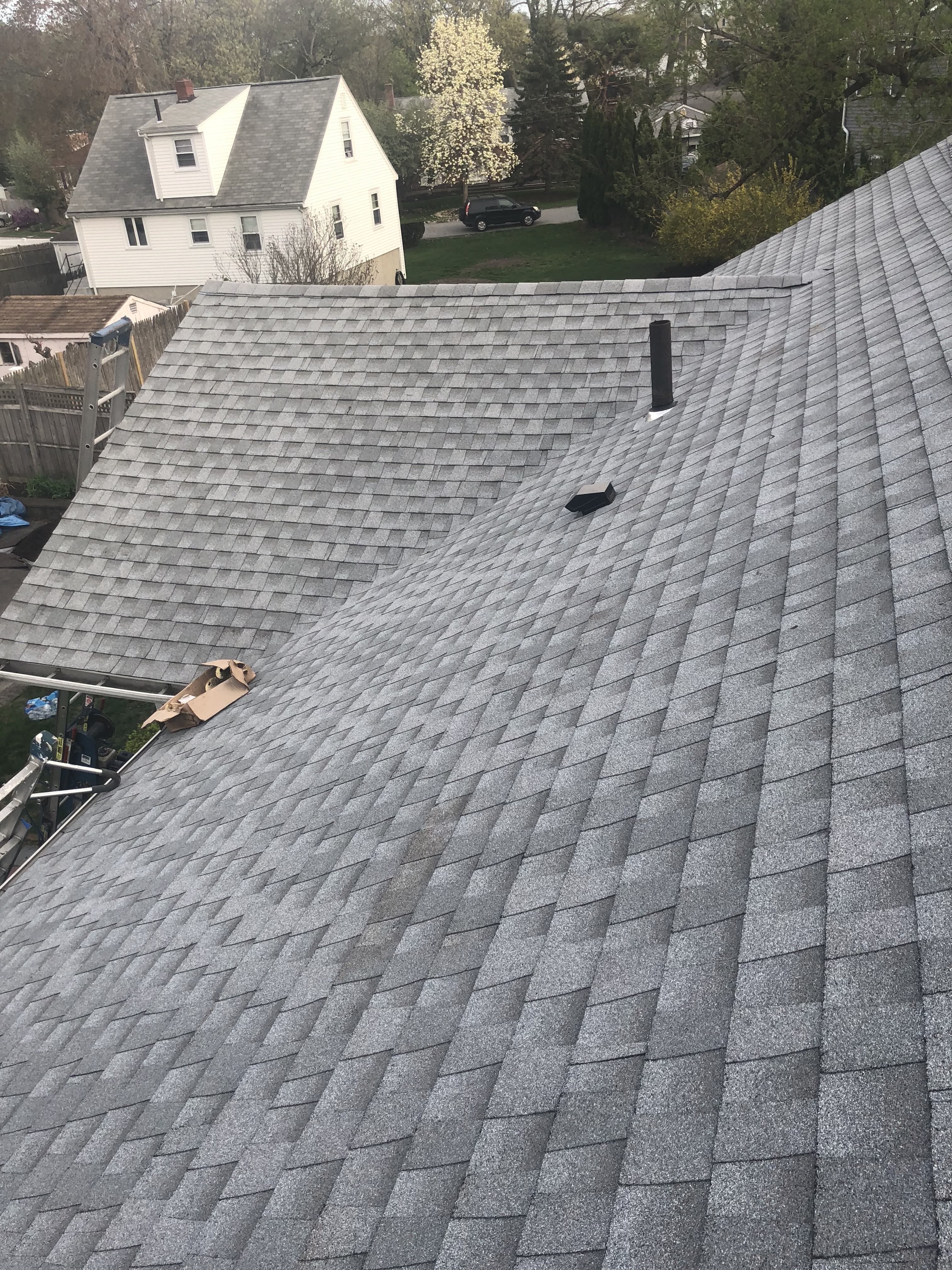 Completed gray architectural shingle roof installed by Storm King Roofing on a home in Waltham, MA